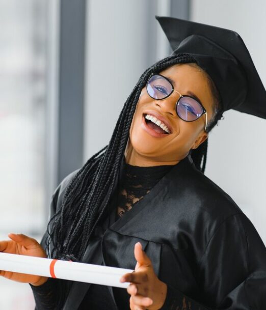 [freepicdownloader.com]-happy-african-american-female-student-with-diploma-graduation-large